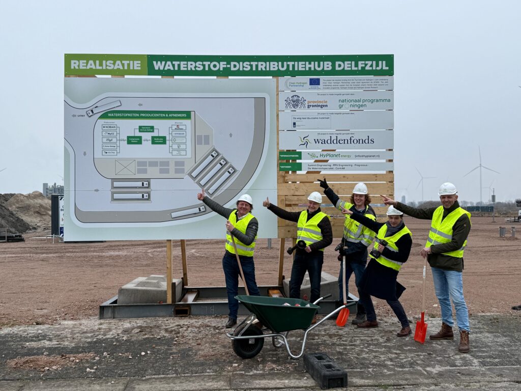 team in front of sign
