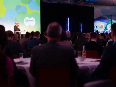 speaker on stage at conference